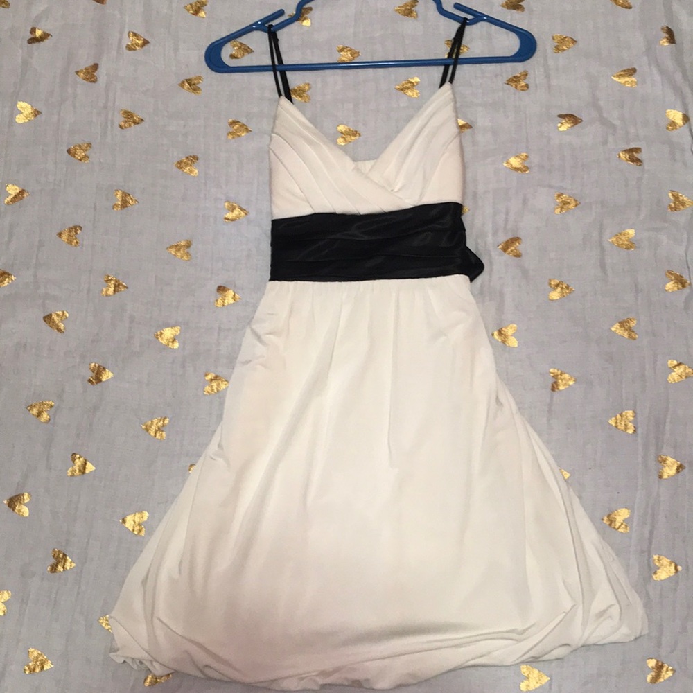 White dress with black bow in the back